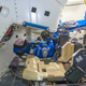 Rosie the Rocketeer, a anthropometric test device, strapped to the commander’s seat inside the CST-100 Starliner spacecraft.